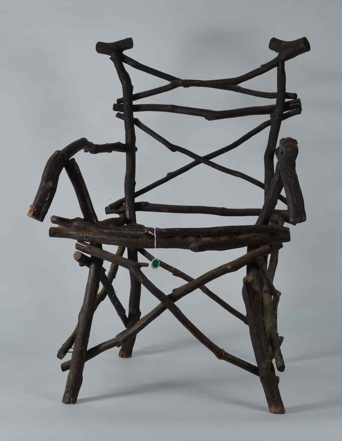 Appraisal: ADIRONDACK ARMCHAIRAmerican Early th CenturyMade of gnarly tree limbs