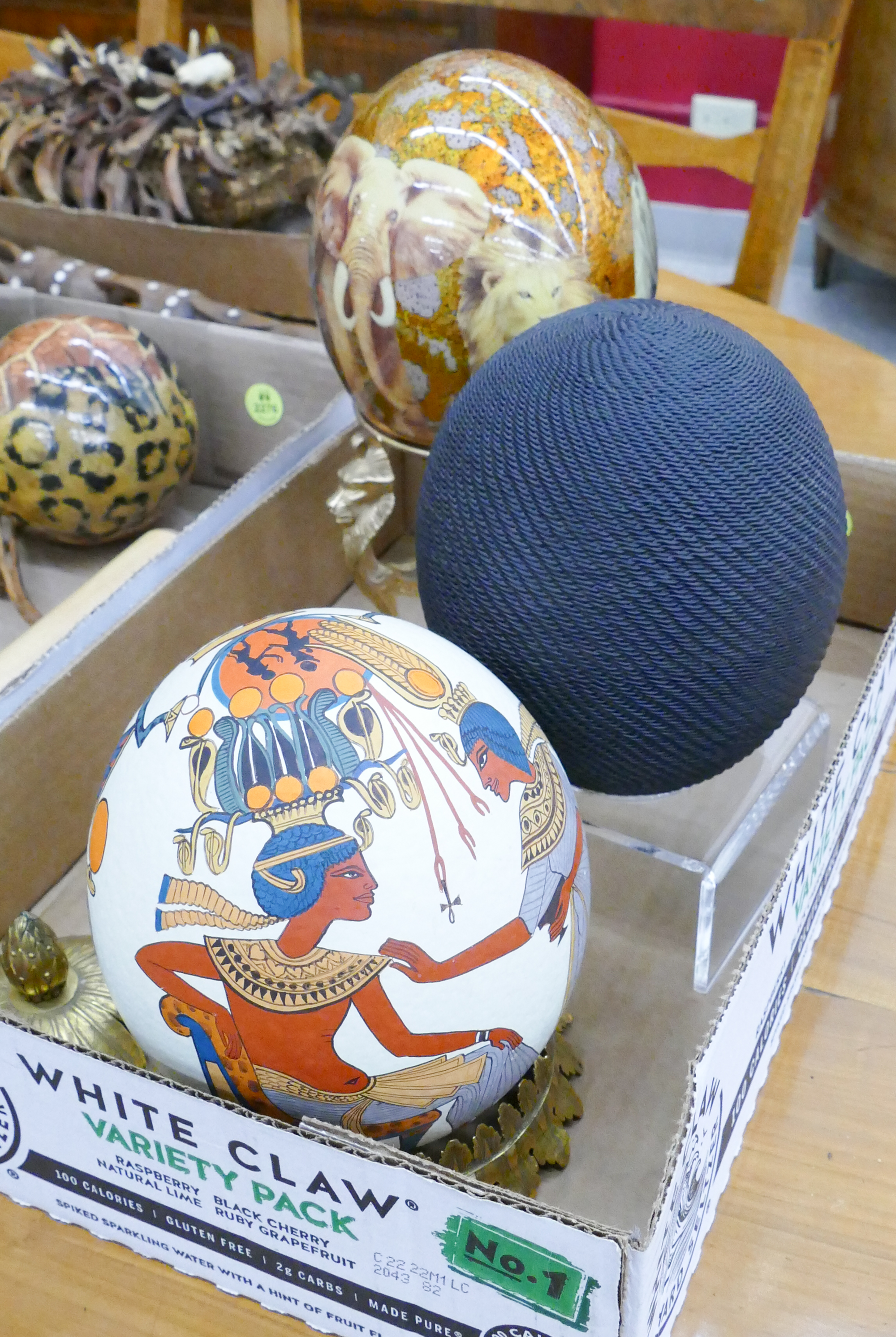 Appraisal: Box Decorated Ostrich Eggs