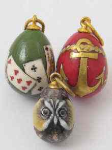 Appraisal: Three Russian gold and enamel egg pendants each approx cm