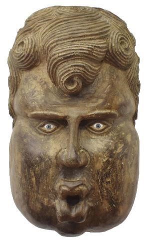 Appraisal: Monumental Mexican carved wood cherubic figure having colored glass eyes