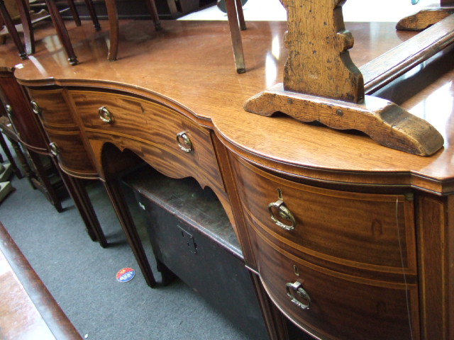 Appraisal: A th century inlaid mahogany inverted bowfront sideboard by William