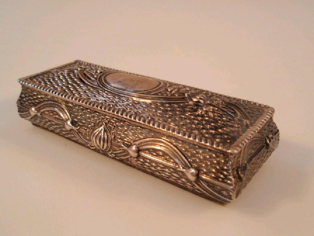 Appraisal: An Edwardian silver rectangular box with hinged lid embossed with