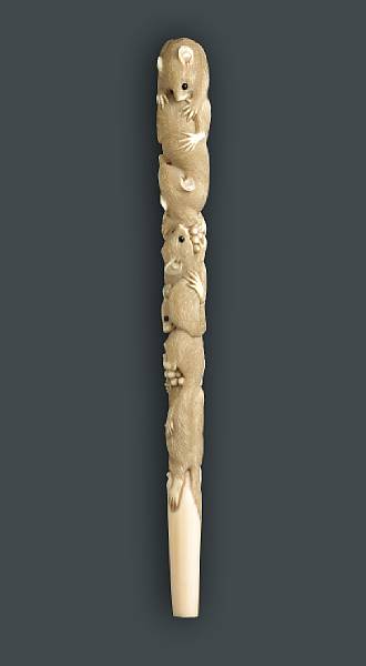 Appraisal: A ivory parasol handle Meiji Period The tapering shaft realistically