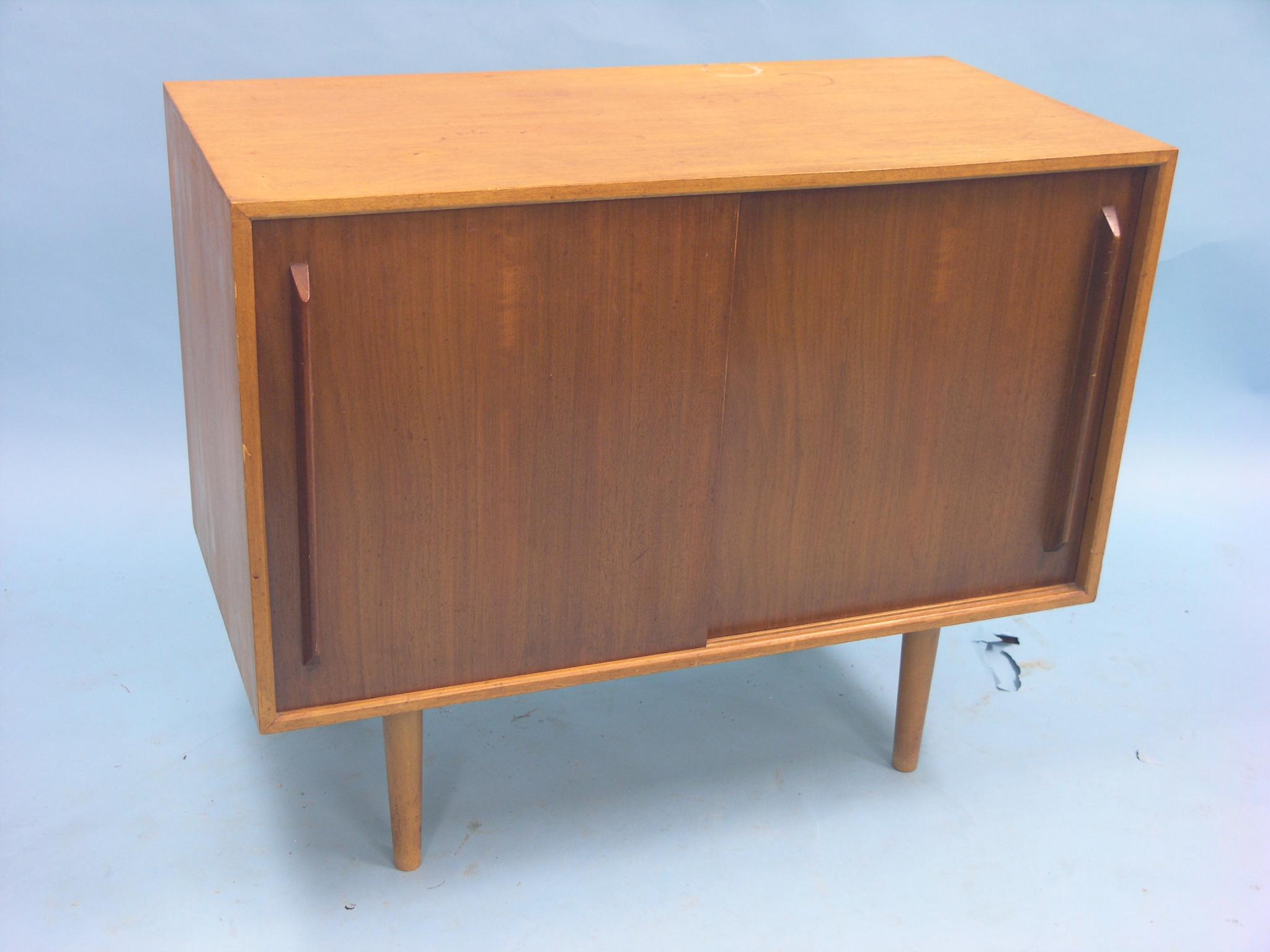 Appraisal: A mid 's teak cupboard designed by Robin Day for