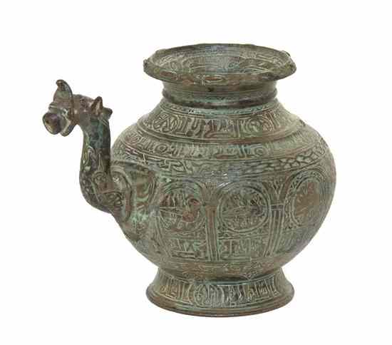 Appraisal: A Middle Eastern Bronze Jug with calligraphic decoration and a