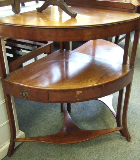 Appraisal: A Regency mahogany corner washstand of three tiers raised on