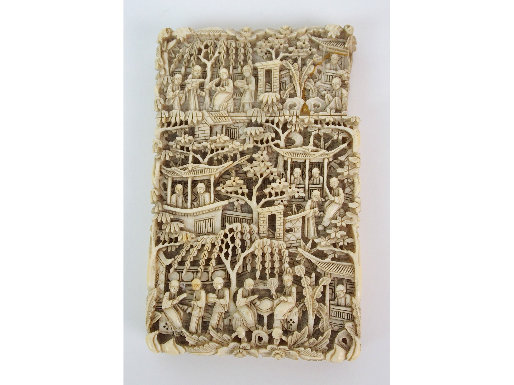 Appraisal: A Cantonese ivory card casedensely carved with figures in pavilions