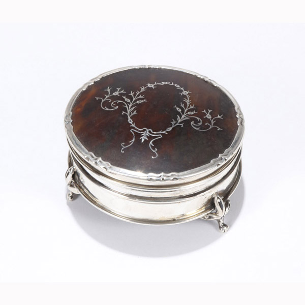 Appraisal: English sterling silver footed round box with floral crest inlay