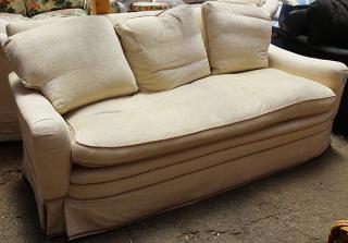 Appraisal: Contemporary custom designed twill upholstered three-seat sofa h x w