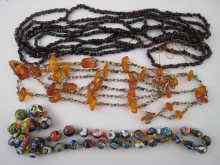 Appraisal: Three necklaces being millefiori glass bead garnet and amber examples