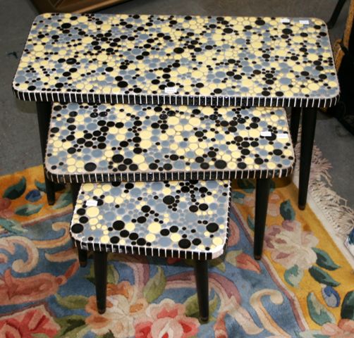 Appraisal: A nest of three tiled low tables the largest cm