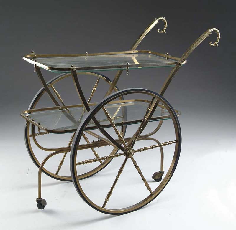 Appraisal: BRASS AND GLASS TWO TIER TEA CART Two large brass