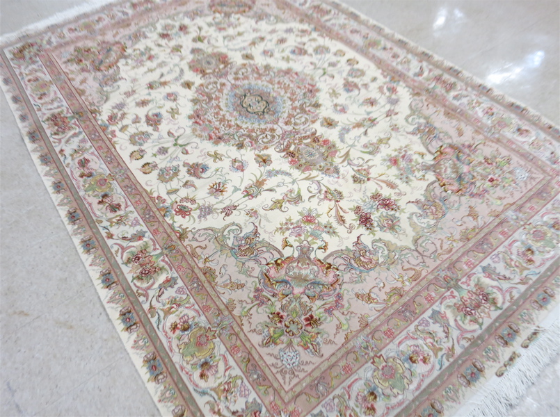 Appraisal: A CONTEMPORARY PERSIAN WOOL AND SILK CARPET floral and central