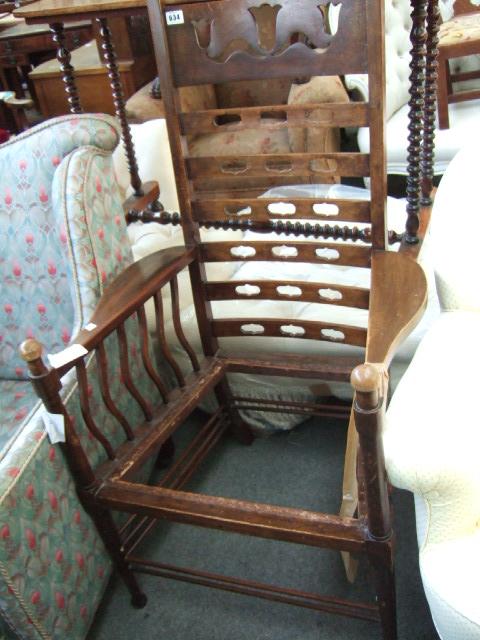 Appraisal: An Arts and Crafts oak ladder back chair the top