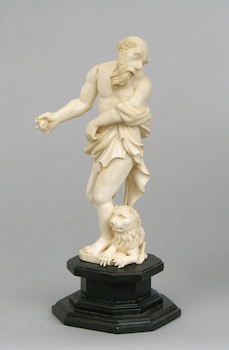 Appraisal: A Carved Ivory Figural of a Man and a Lion