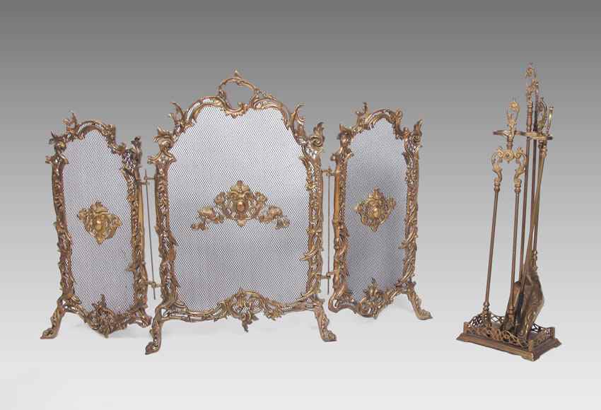 Appraisal: ITALIAN ROCOCO FIRE SCREEN TOOLS Ornate cast metal panel screen