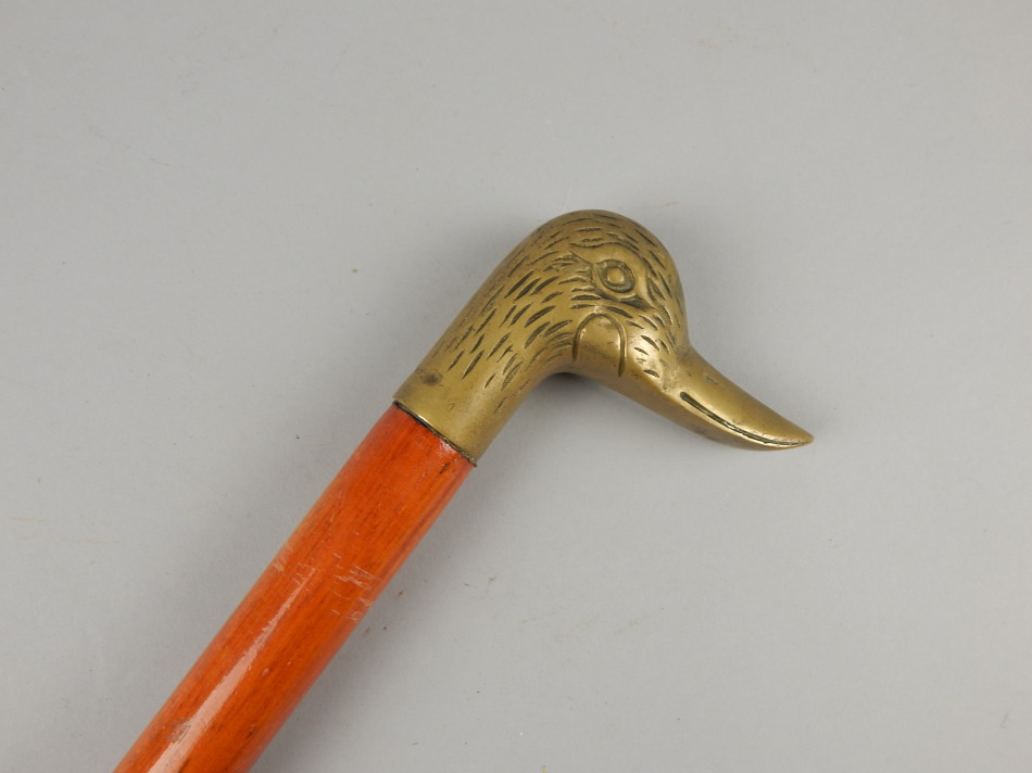 Appraisal: A thC novelty walking cane with brass duck head and