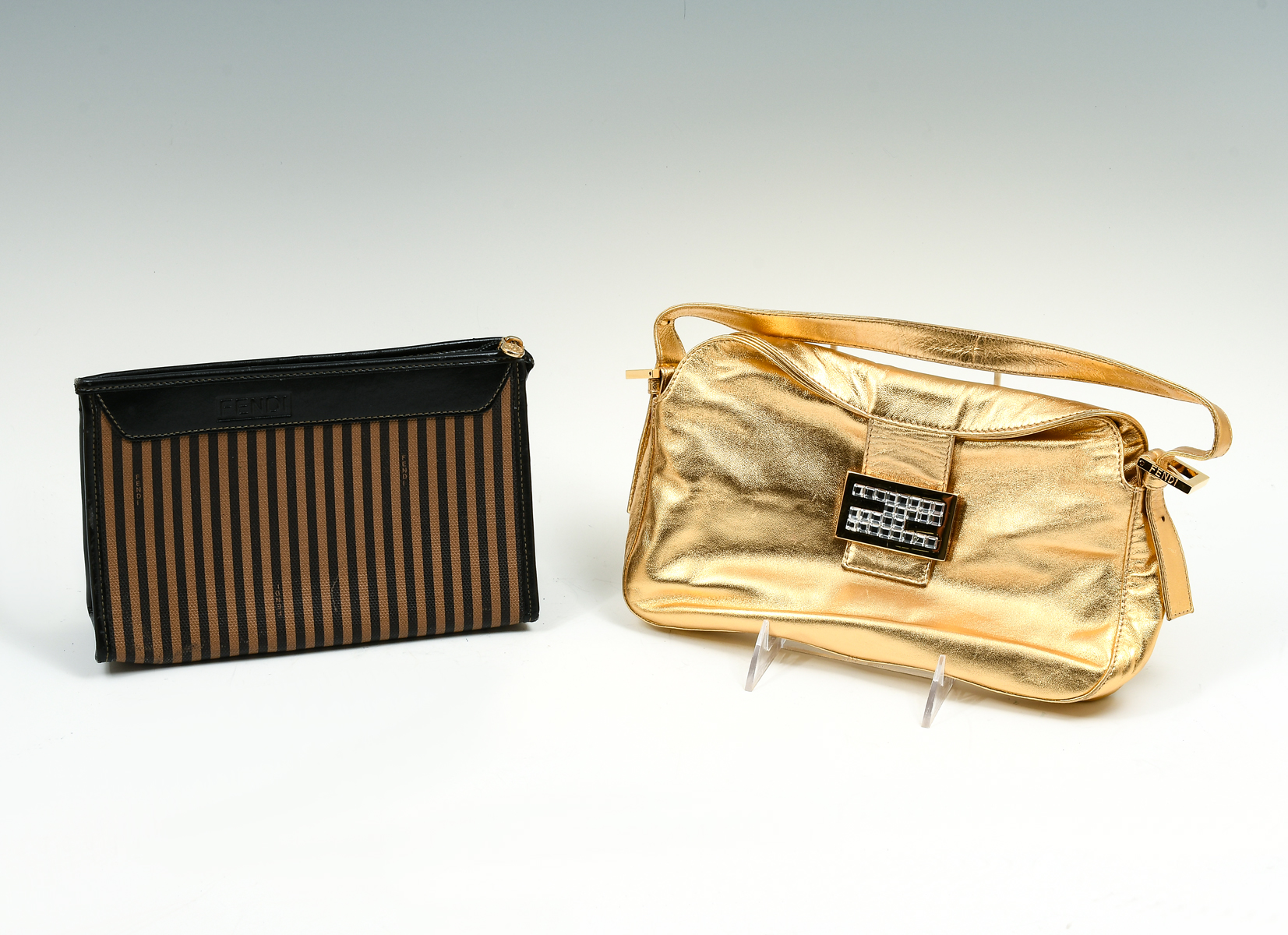 Appraisal: FENDI PURSES Metallic gold leather purse is embellished with Fendi