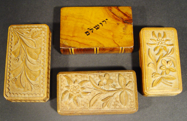 Appraisal: Three wooden matchboxes each carved with flowers to the lid