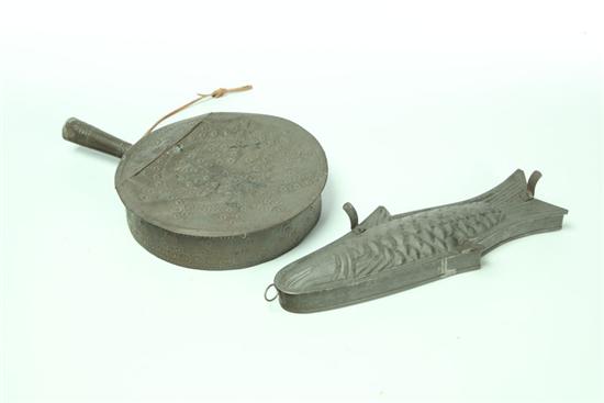 Appraisal: TIN FISH MOLD AND PUNCHED TIN WARMER American nd half-