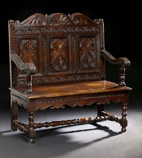 Appraisal: English Carved Oak Settle th century the shaped and foliate-carved