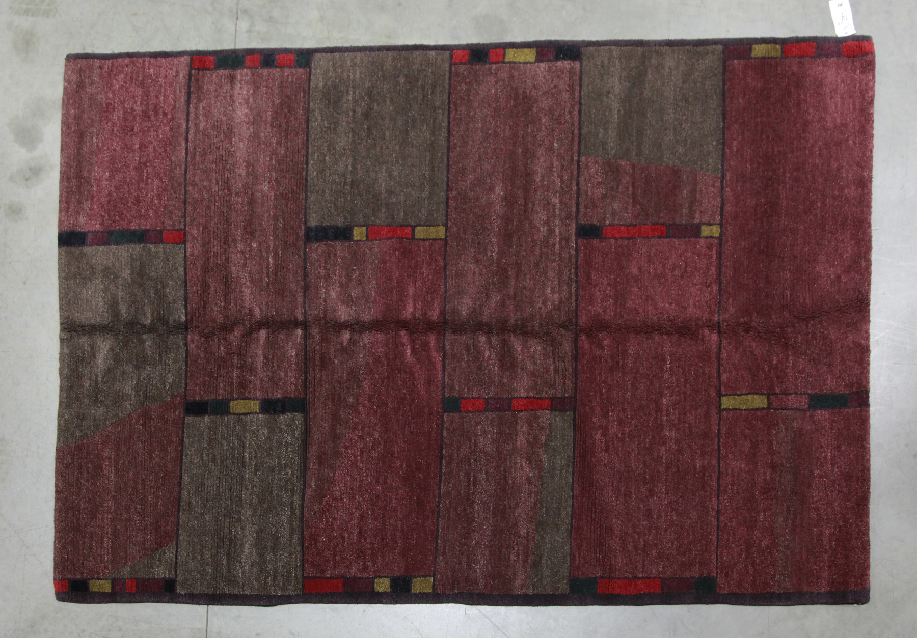 Appraisal: TIBETAN ORIENTAL RUG Nepal nd half- th century Grid pattern