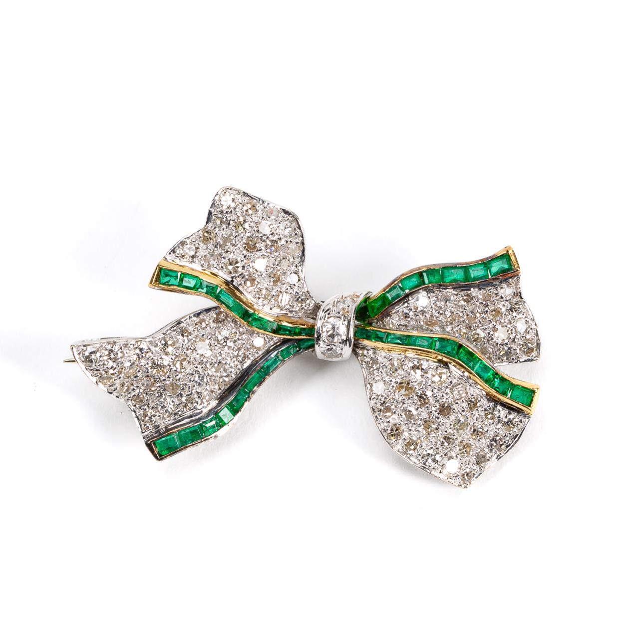 Appraisal: PLATINUM DIAMOND EMERALD BOW FORM BROOCH Platinum emerald and diamond