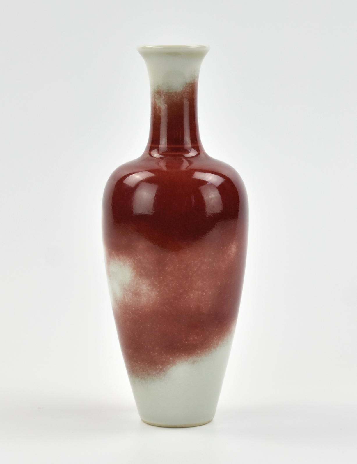 Appraisal: a flambe peach blossom glazed vase of elegant form with