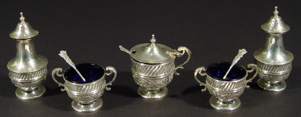 Appraisal: Edwardian silver five piece cruet set the bodies embossed with