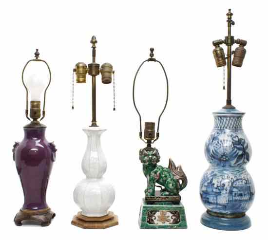 Appraisal: A Collection of Four Ceramic Lamps th century comprising a