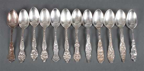 Appraisal: Twelve American sterling silver floral repousse dessert spoons by Wallace