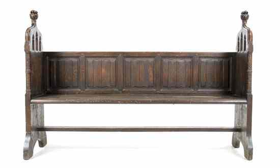 Appraisal: A Gothic Revival Carved Oak Bench having linen fold carved