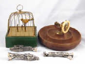 Appraisal: A mixed lot A birdcage musical box the bird hopping