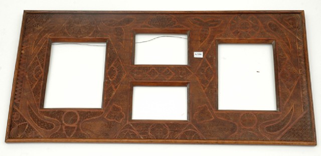 Appraisal: A LARGE EDWARDIAN CHIP CARVED FRAME Rectangular with four windows