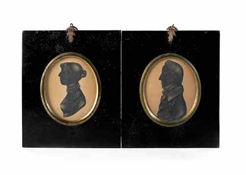 Appraisal: Two miniature watercolor portraits th c together with two silhouettes