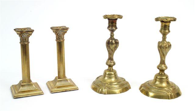 Appraisal: PAIR OF GEORGE III STYLE BRASS COLUMNAR CANDLESTICKS each with