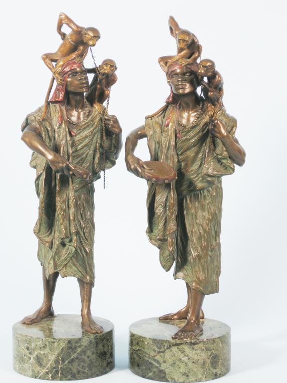 Appraisal: Pair of bronze Figures of African Men each with two