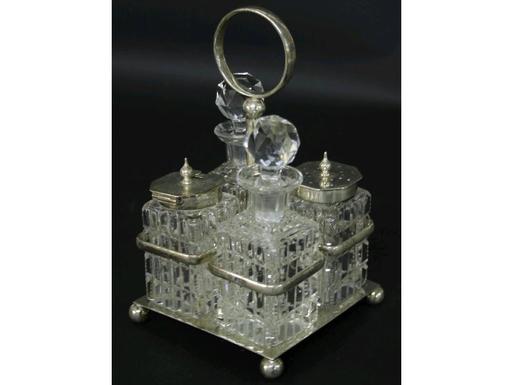 Appraisal: Late Victorian silver cruet stand complete with two glass decanters