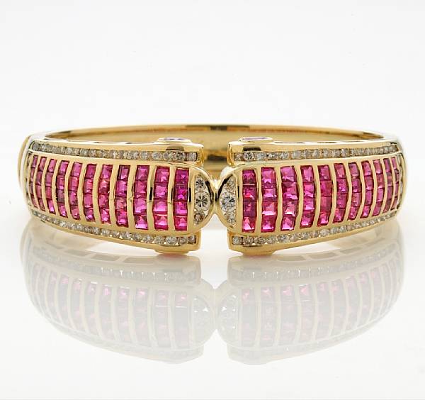 Appraisal: A ruby and diamond bangle bracelet estimated total ruby weight