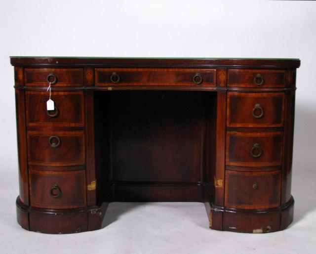 Appraisal: Sligh mahogany kidney shaped desk with tooled leather insert top