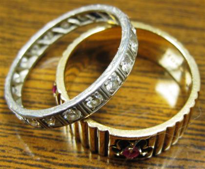 Appraisal: Two band ringsIncluding one karat ring with rubies Size one