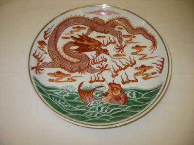 Appraisal: A CHINESE PORCELAIN CHARGER painted in red with a dragon