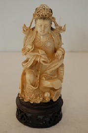 Appraisal: A CARVED CHINESE IVORY STATUE OF A FEMALE DEITY