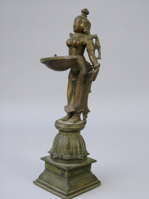 Appraisal: A Southern Indian cast bronze figural oil lamp in the