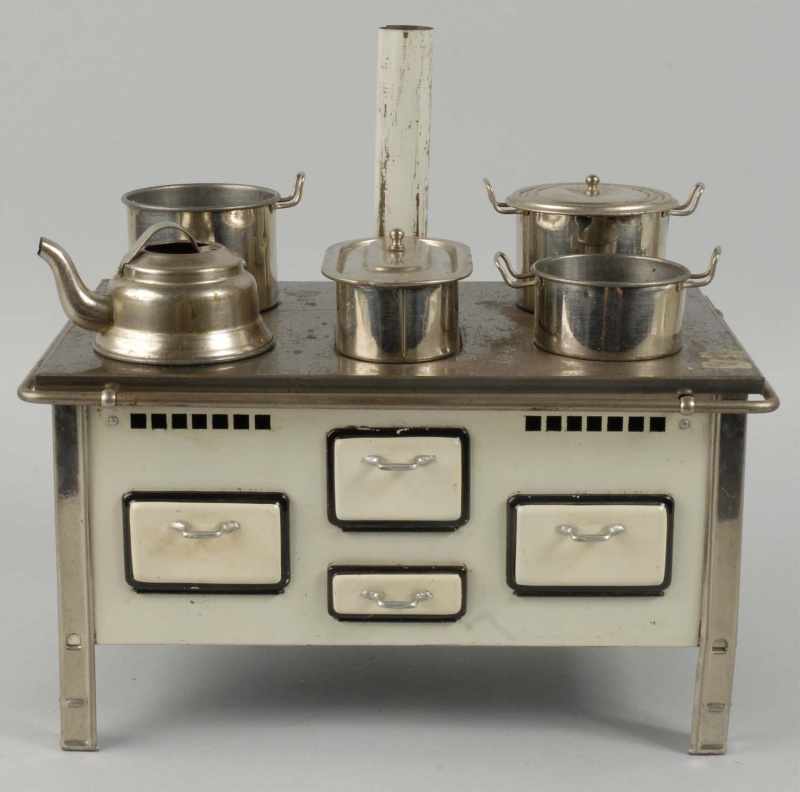 Appraisal: Tin Children's Stove Description German Includes accessories Tin top has