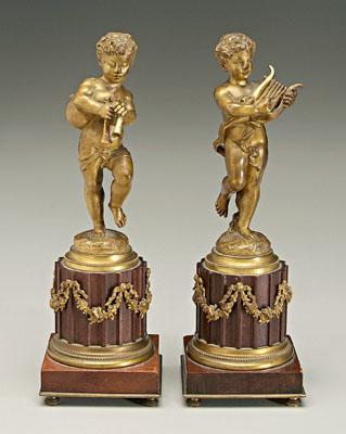 Appraisal: Pair of Bronzes after Moreau putti with bagpipes and harp