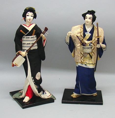 Appraisal: Pair of Japanese dolls Male and female He is holding