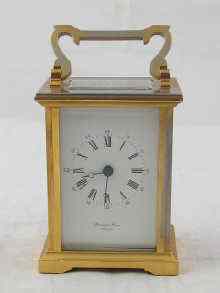 Appraisal: A gilt cased carriage clock with English movement the dial