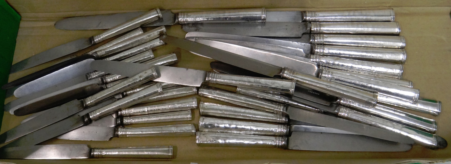 Appraisal: Thirty-three silver handled and steel bladed knives in approximately three