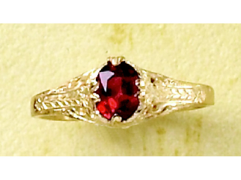 Appraisal: RED SPINEL RING k yellow gold engraved lady's solitaire ring